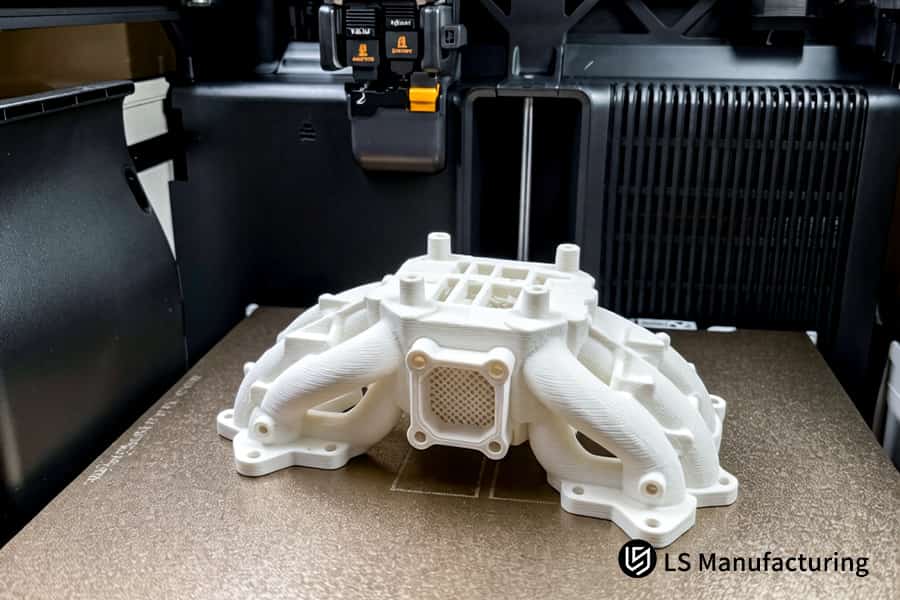 White TPR elastomer forms complex fluid manifold channels for industrial automation prototyping systems.