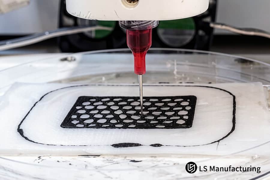 A 3D printer nozzle deposits vitreous carbon filament to form a solid structure.