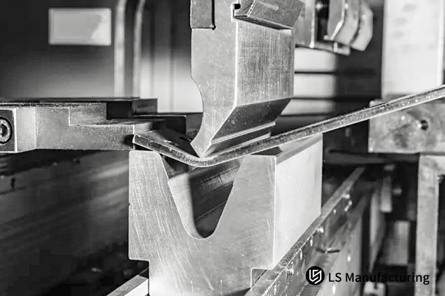 Bending a thin aluminum sheet into an angled part for aerospace equipment housing with high tolerance.