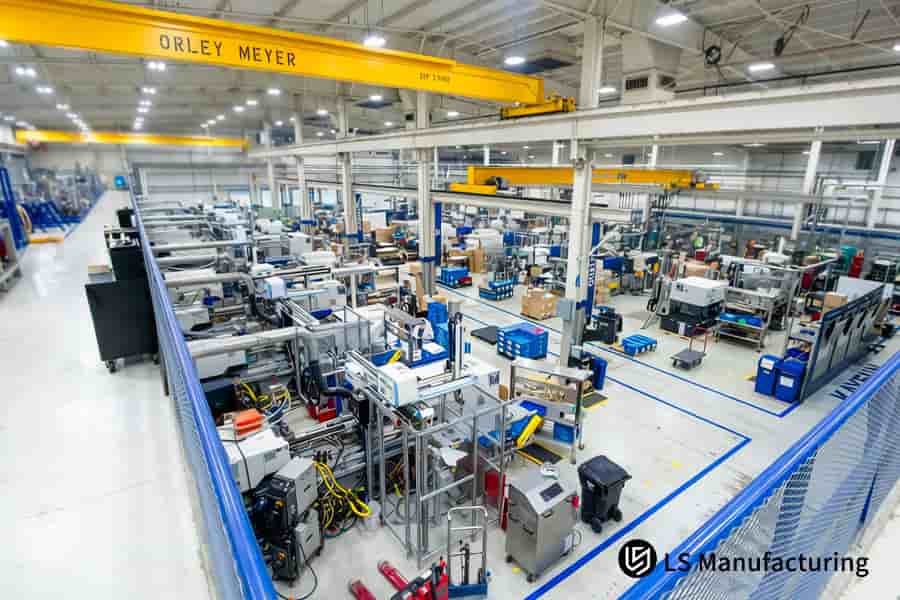 Industrial machines shape HDPE granules into large storage drums via blow molding processes.
