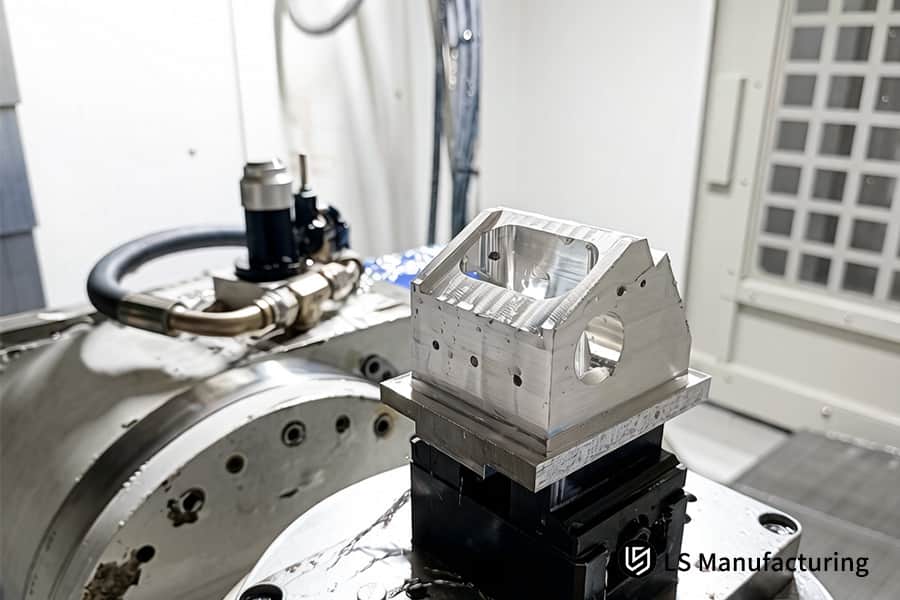 Precision CNC machining simultaneously cuts complex internal geometries in aluminum aerospace manifold component.