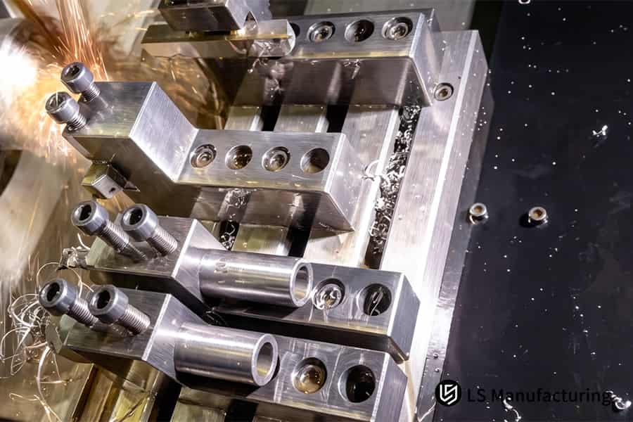 Precision machining center cutting mold cavities generates fine metal shavings for industrial tooling.