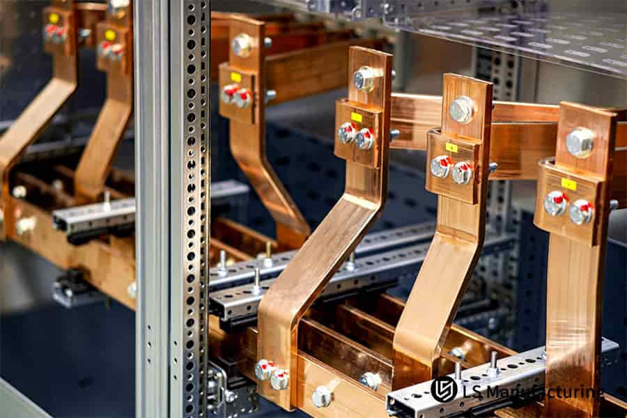 Sheet metal busbar assembly with spacers