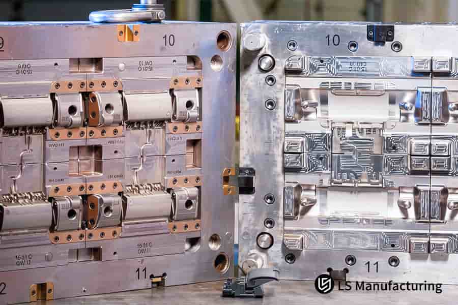 Flash free mold tooling forms multiple plastic forks in polished stainless steel cavities.