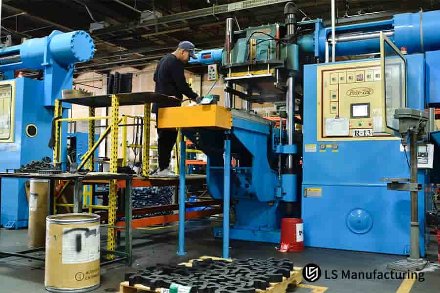 A large industrial press monitors parameters to create defect-free aerospace parts from exotic resin.