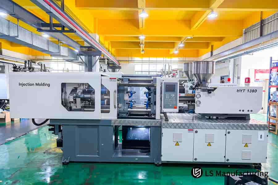 The HYT 1380 machine with a digital display operates custom injection mold tooling in the LS Manufacturing facility.