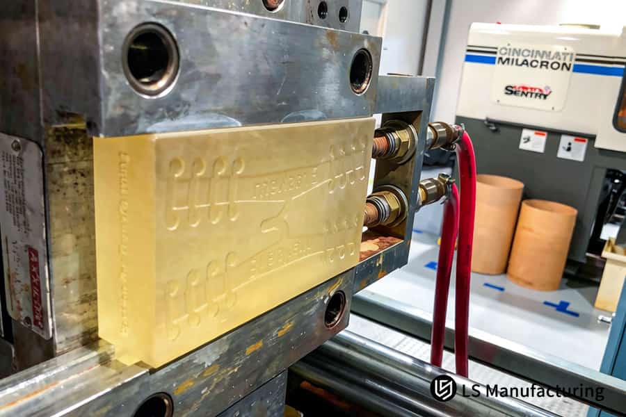 A precision steel mold holds exotic resin for critical-use parts under multiple ISO certifications.