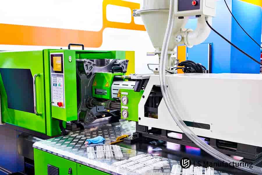 Injection molding DFM services ensure precise control as the green HYT machine injects molten thermoplastic.