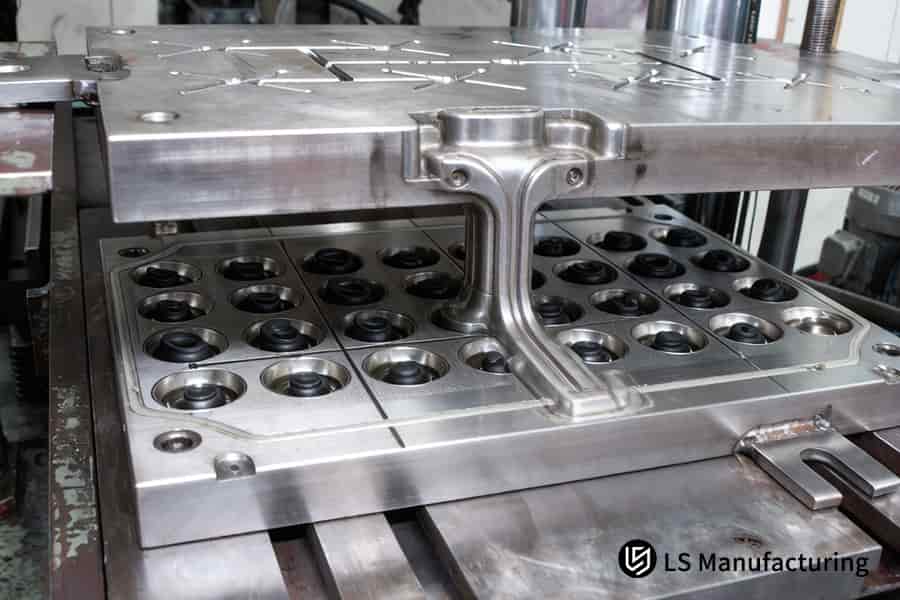 Molten silicone fills 32 polished cavities in the metal mold to create precision gaskets every 45 seconds.