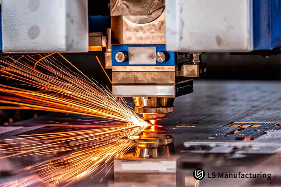 Laser cutting torch slices through 6mm carbon steel plate for construction equipment manufacturing.