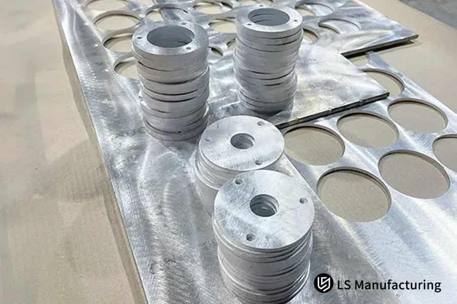 Laser-cut Inconel and Monel parts in a stack