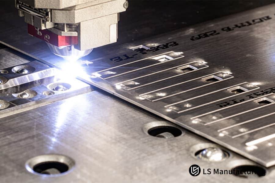 Laser cutting head etches technical markings on 6061 aluminum plate for automotive component identification.