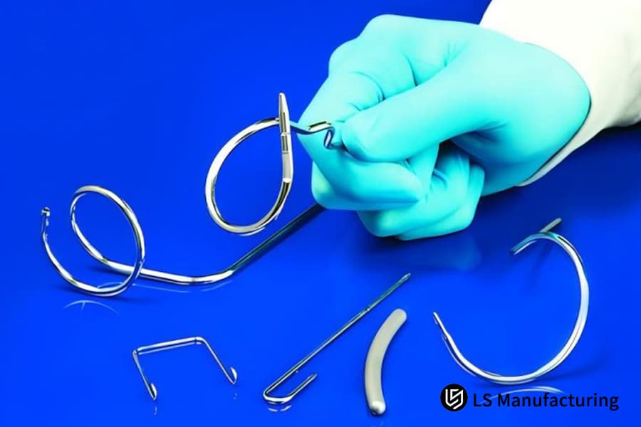 Precision bent medical metal components in hand