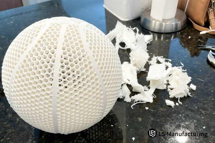 PLA Plus 3D printing service tests large prototype sphere for impact resistance in lab.