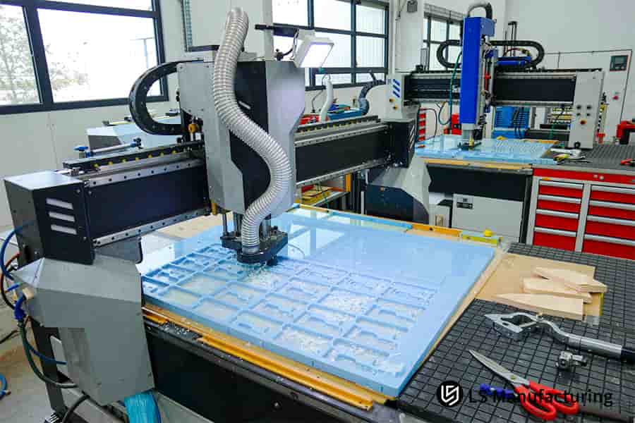 Plastic CNC machining service shapes blue polymer plate with 8 bar coolant.