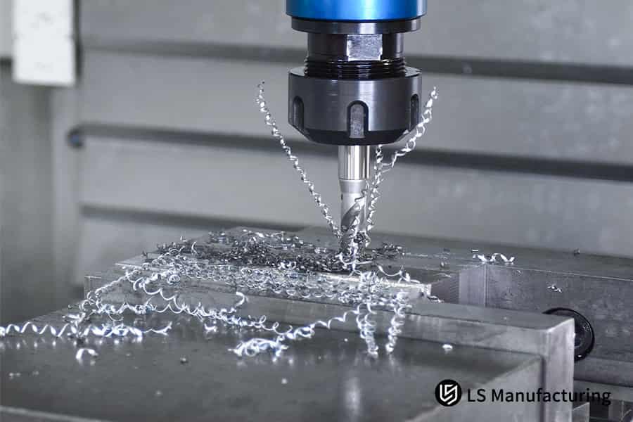 Precision CNC tapping in action with metal chips flying by LS Manufacturing.jpg