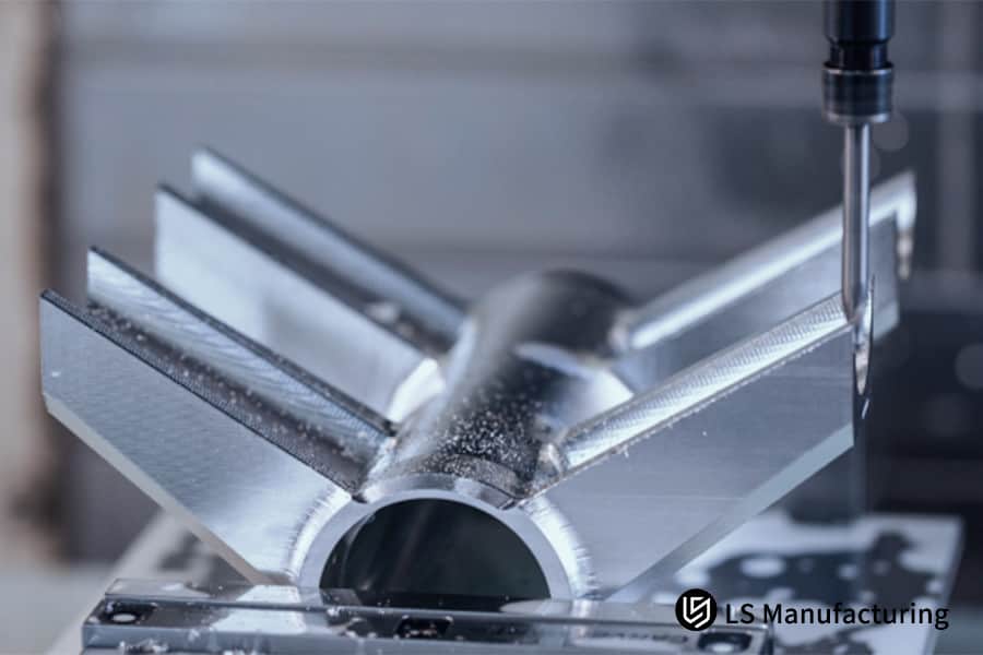 Precision milling of a metal component with intricate wings by LS Manufacturing.jpg