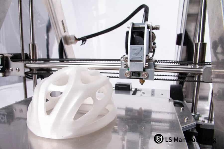 CNC rapid prototyping a white plastic helmet prototype for cost-effective low-volume production services.