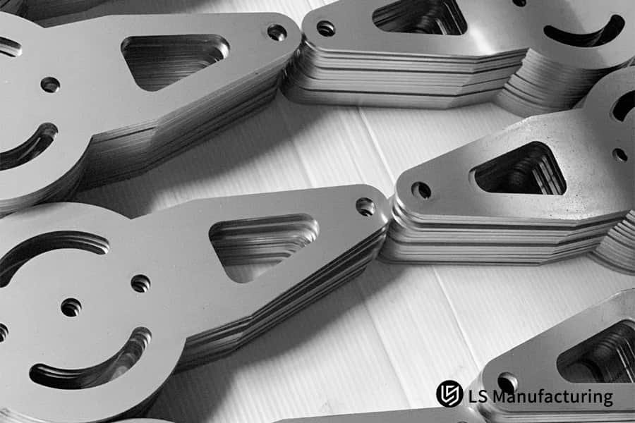 Stacked sheet metal parts show precise cut edges