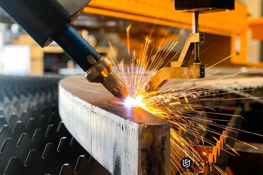 An automated welder joins two beveled pipe sections for industrial process or structural pipeline systems.